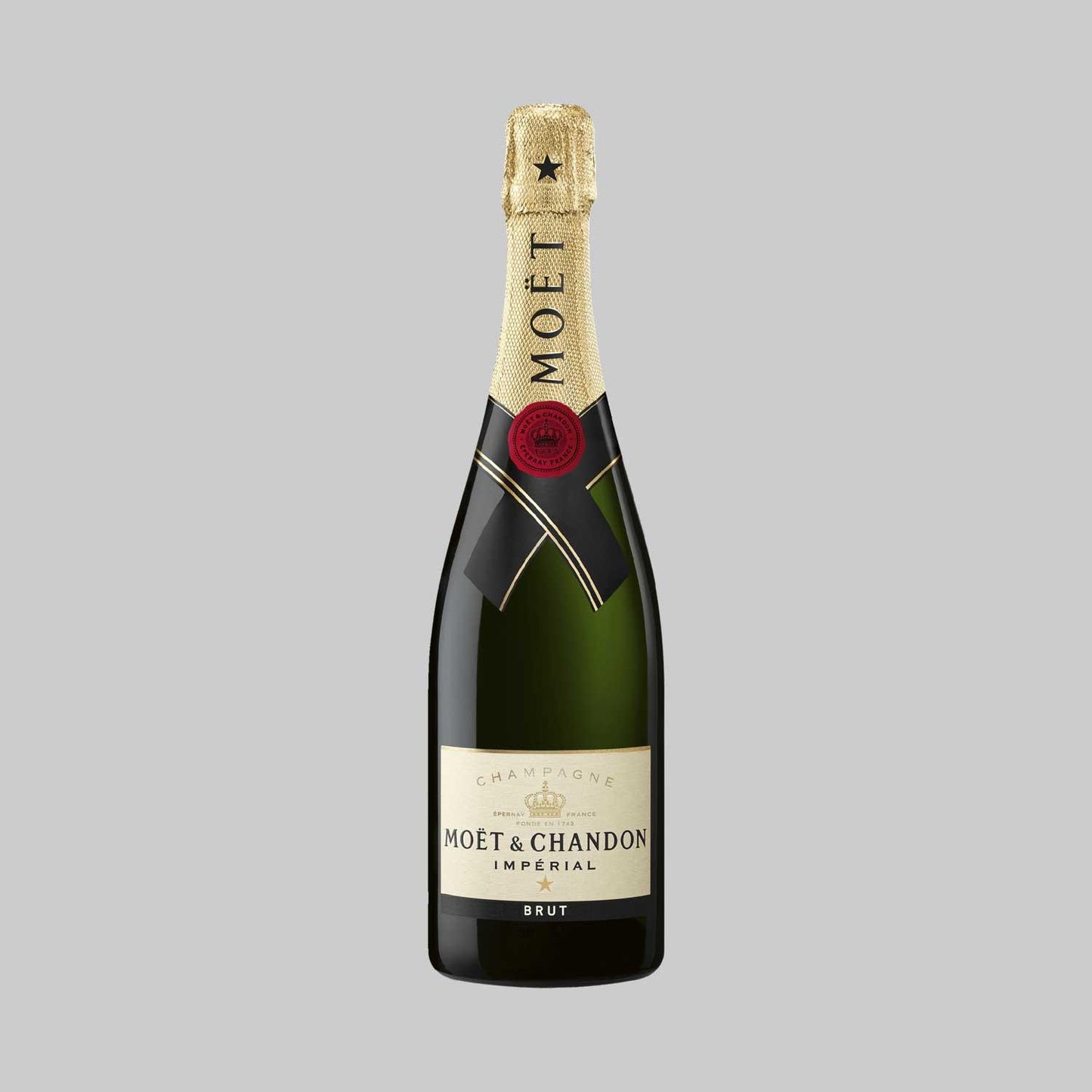 Moet & Chandon Impérial Brut Champagne bottle on a plain grey background